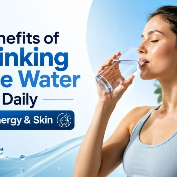 Woman drinking a glass of water to experience the benefits of drinking more water daily